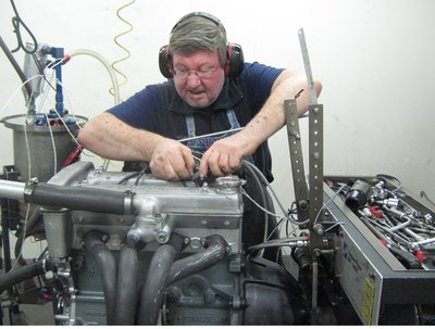 Barry wkg on engine on dyno at PHP resized.jpg and 